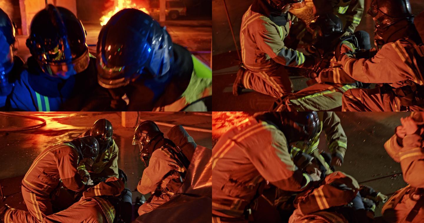 消防员在帮助受伤的消防员同伴