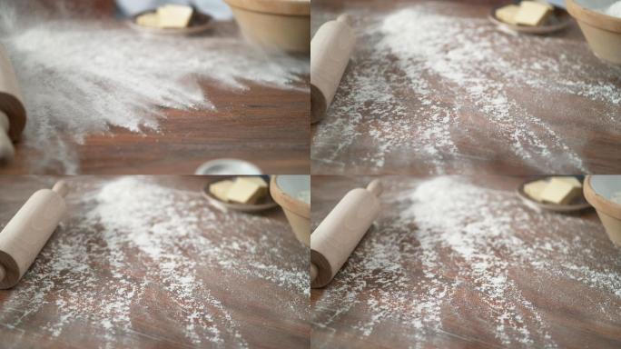 把面粉筛到砧板上餐桌擀面杖超级慢动作