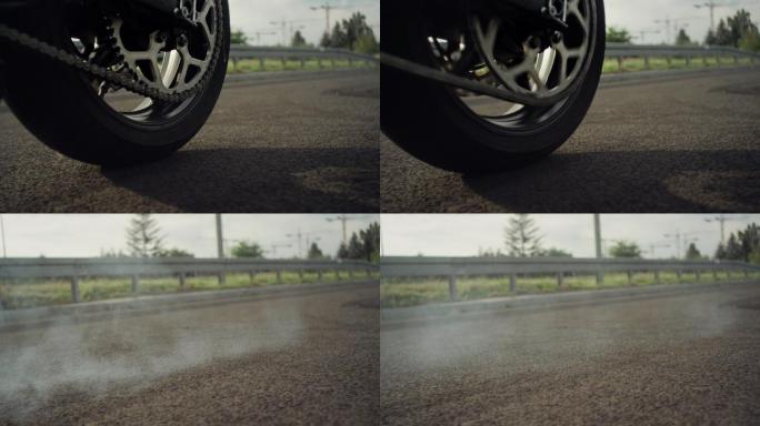 摩托车轮胎在路上打转的特写镜头