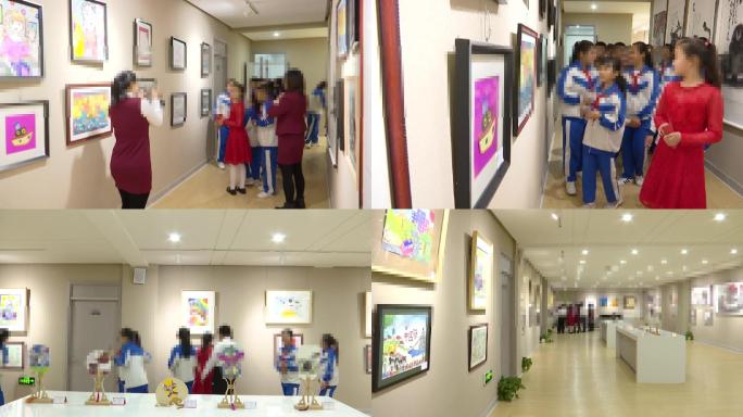 小学生参观讲解美丽中国绘画展