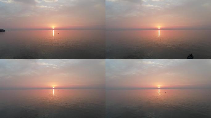 无人机航拍海面夕阳与渔船