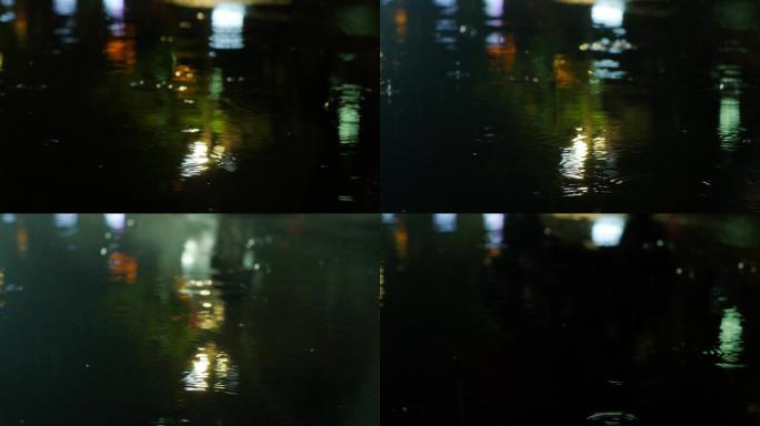 夜晚下雨路面-雨水雨滴车流特写
