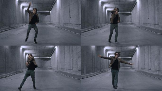 一个年轻潮人在水泥隧道里劲舞嘻哈