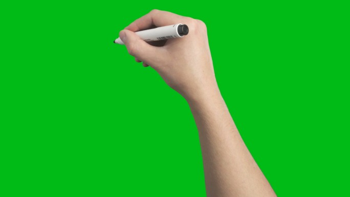 一只手在绿屏上涂鸦写作