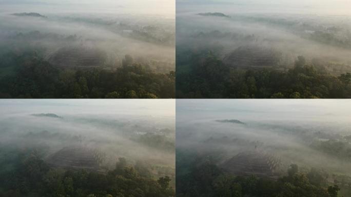 雾中日出时婆罗浮屠寺的风景鸟瞰图