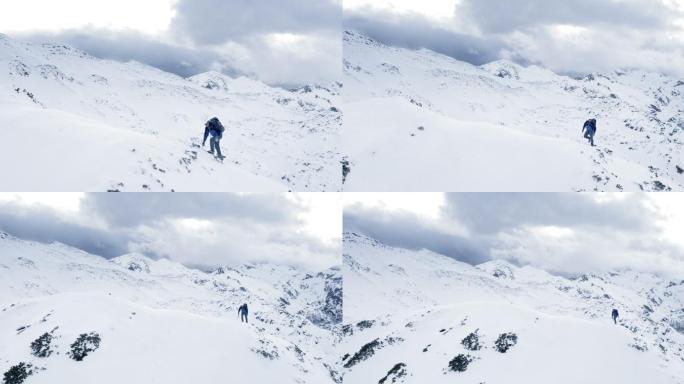 空中登山者用冰爪和雪斧征服这座山