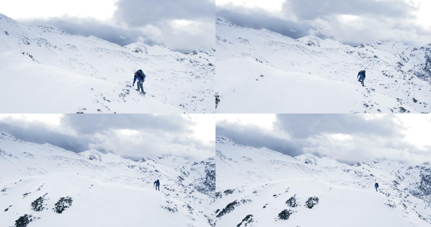 空中登山者用冰爪和雪斧征服这座山