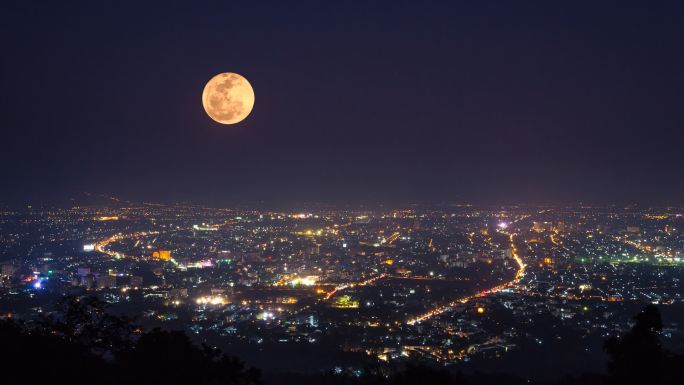 夜晚城市月亮慢慢升起圆月中秋月亮