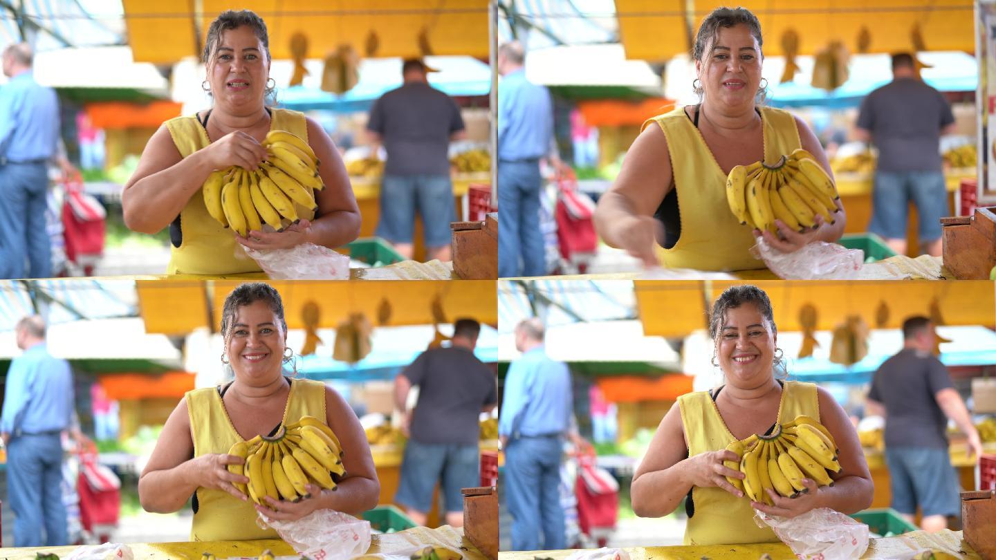 自信的商贩在农贸市场卖香蕉