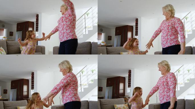 奶奶和孙女在客厅跳舞