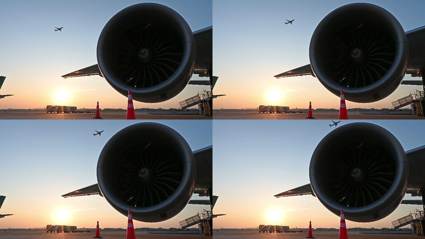 夕阳下停在机场的飞机的涡轮发动机