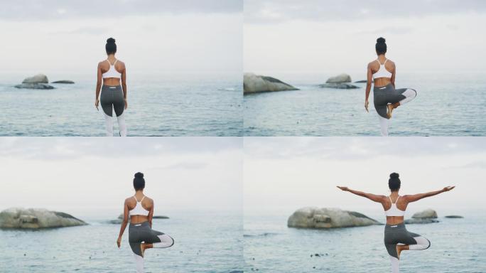 在海滩练习瑜伽的女人