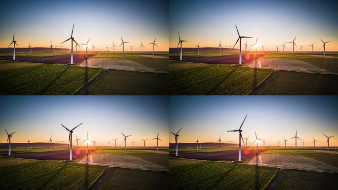 夕阳下转动的风力涡轮机