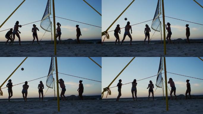 在沙滩上打排球的女人