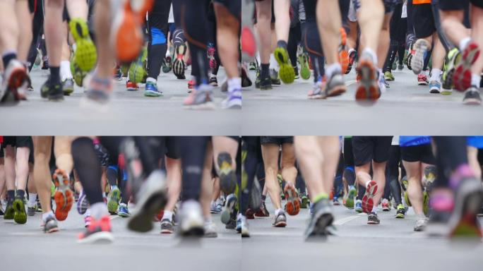马拉松比赛中特写跑步者的腿。