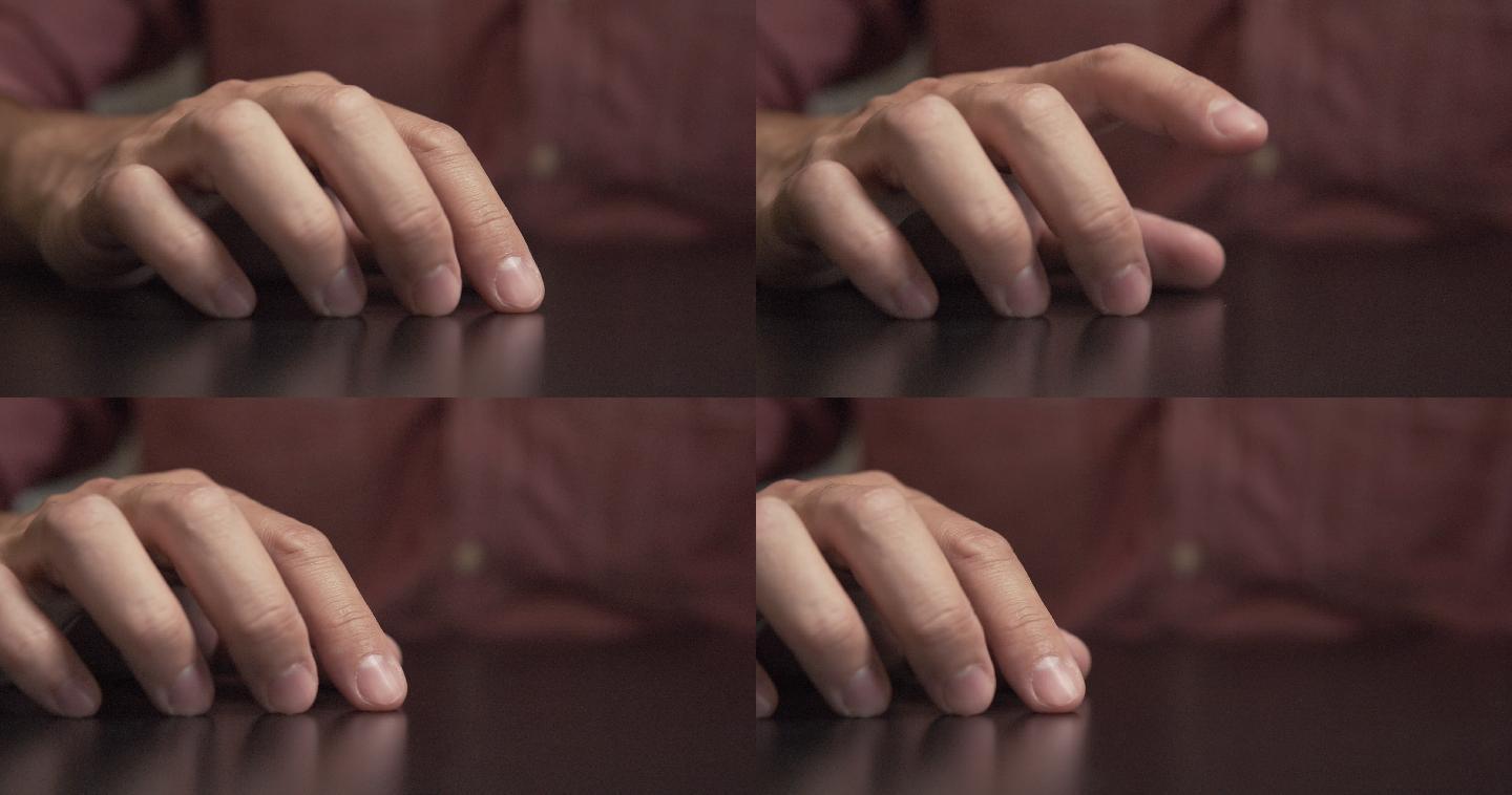 男人感到紧张,用手指轻拍桌子