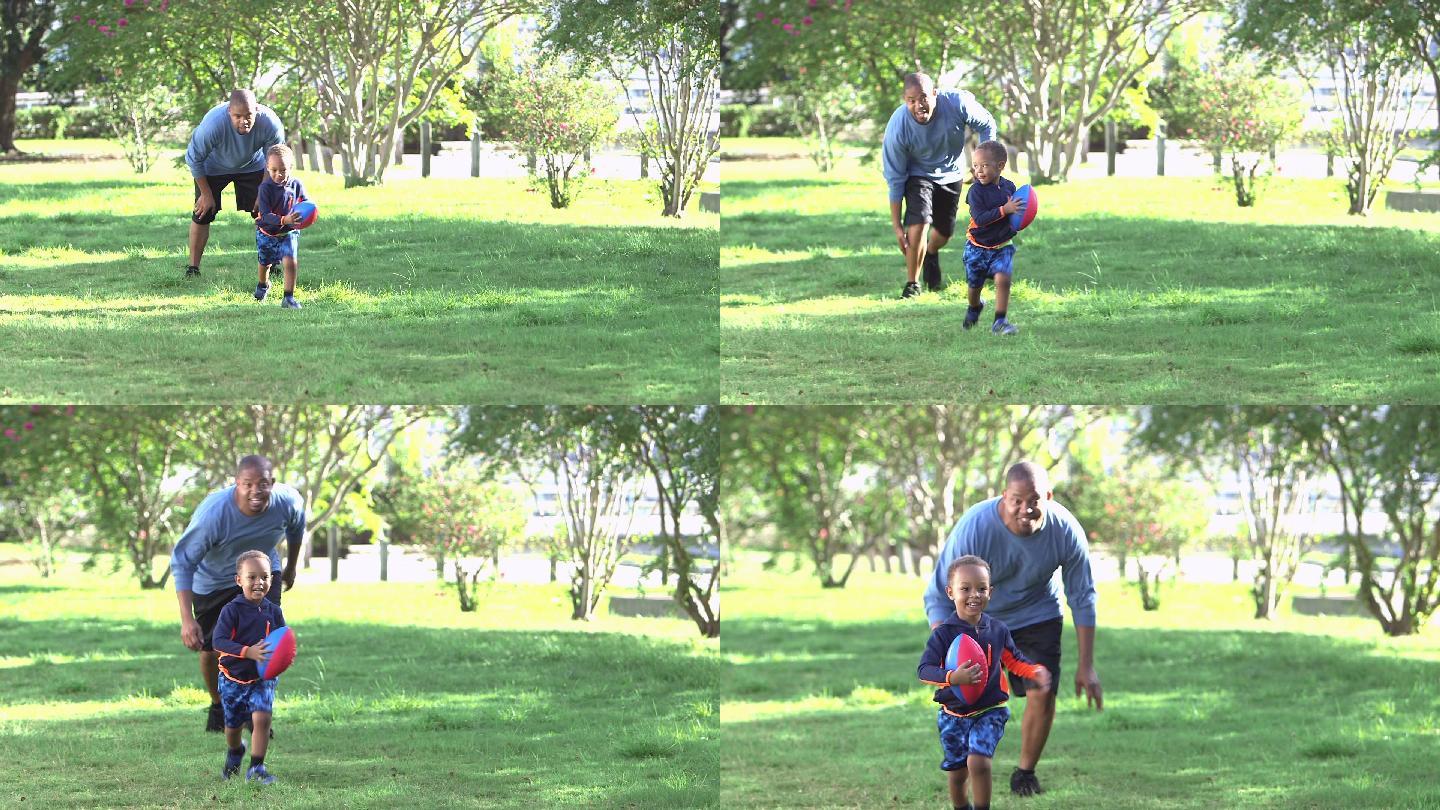 爸爸抱着足球追着小男孩
