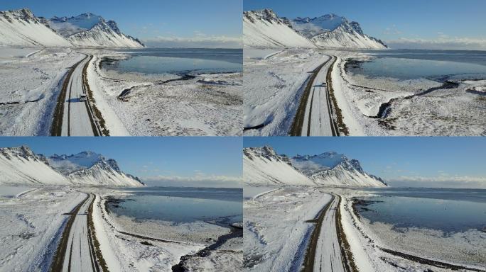 被冰雪覆盖的道路和雪山景观