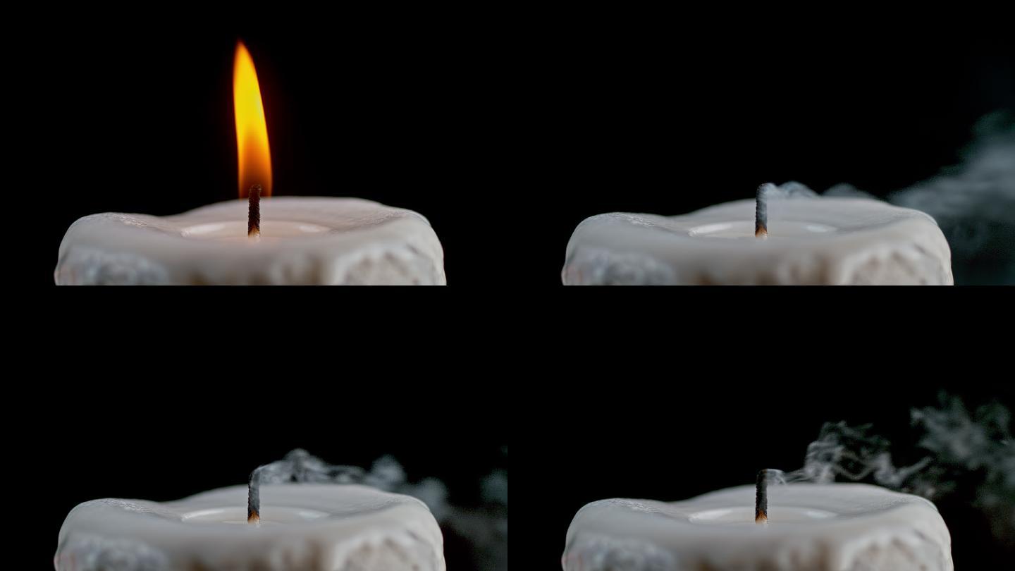 一根白色的蜡烛被吹灭了