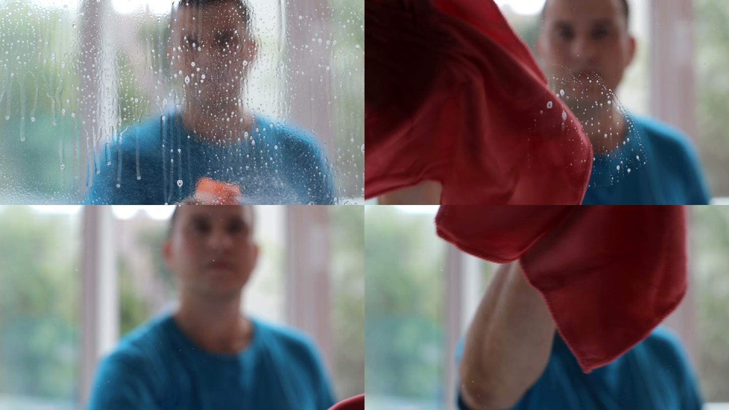 一个男人擦窗户