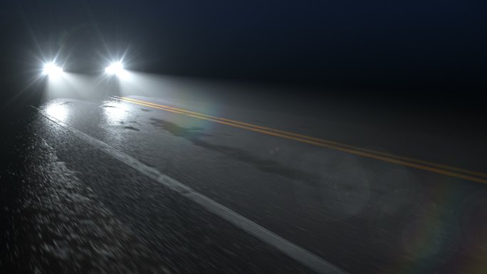汽车行驶在乡间夜晚潮湿的道路上
