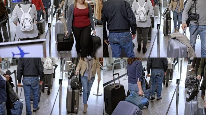 人们带着行李排队走向机场的登记处