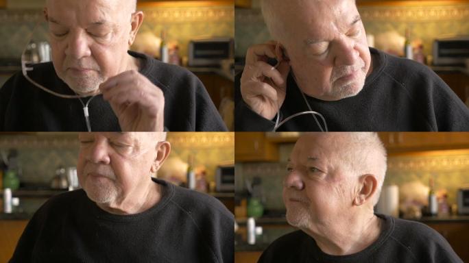 一位生病的老人把氧气管从鼻子上取下来