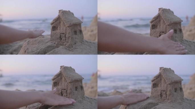 在沙滩玩沙子堆小房子