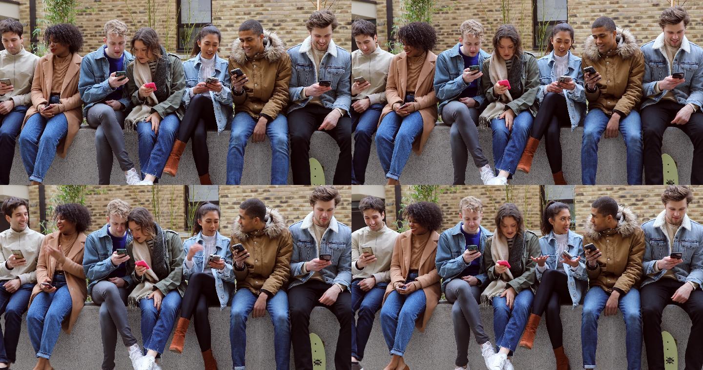 一群青少年朋友专注于自己的智能手机