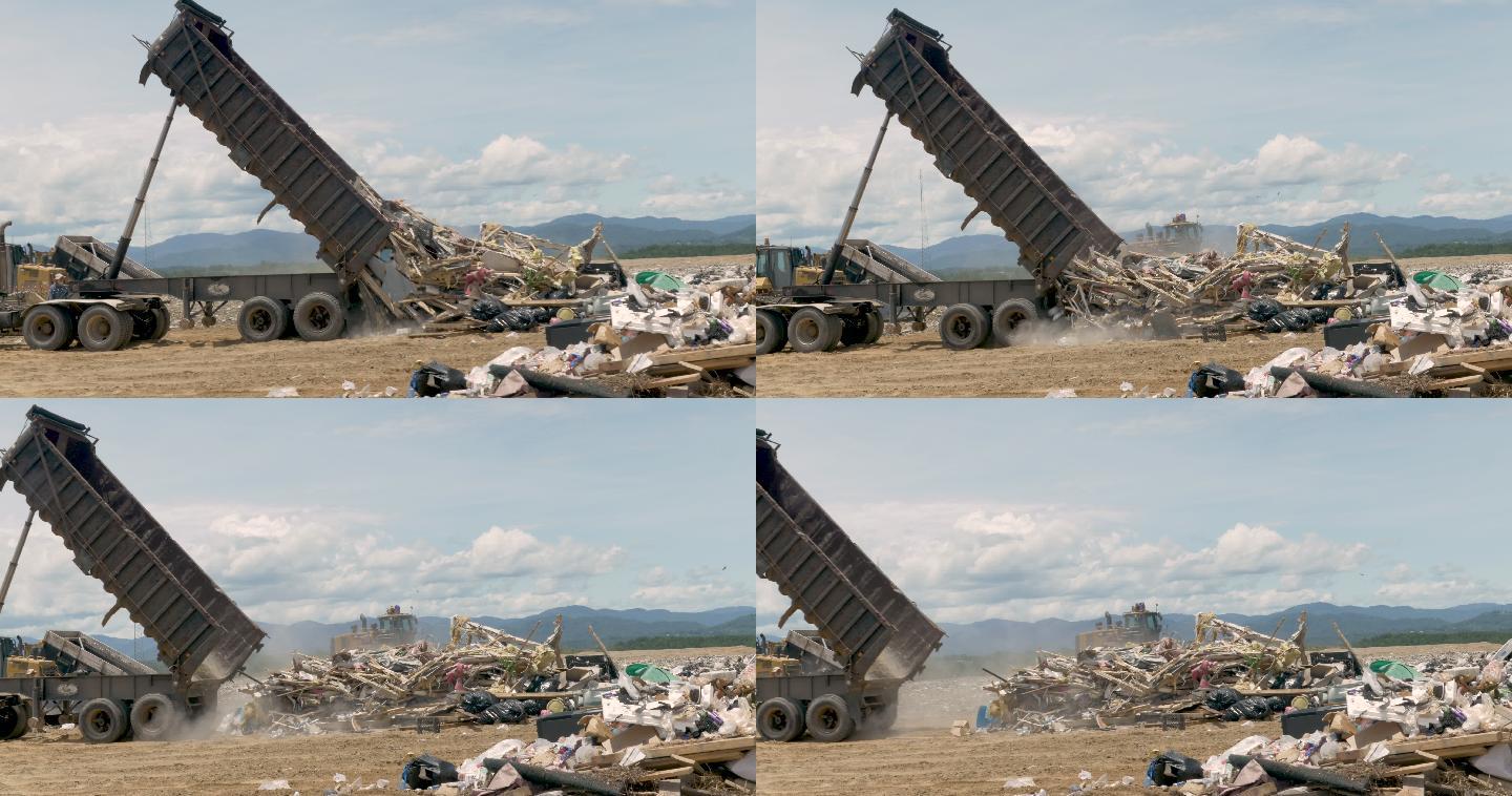 卡车在垃圾填埋场倾倒建筑垃圾