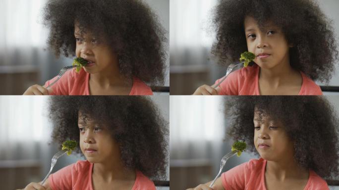 女孩吃花椰菜