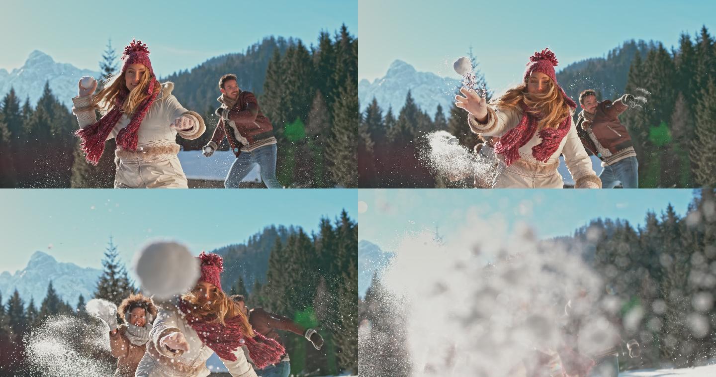 一个年轻的妇女朝着相机扔雪球