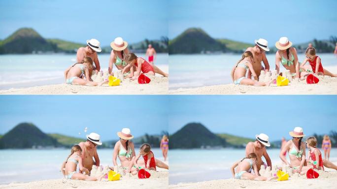 暑假一家人在白色沙滩上建造沙堡
