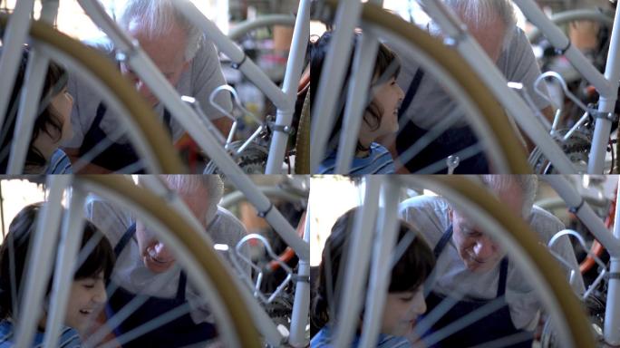 爷爷和孙子在调整脚踏车踏板