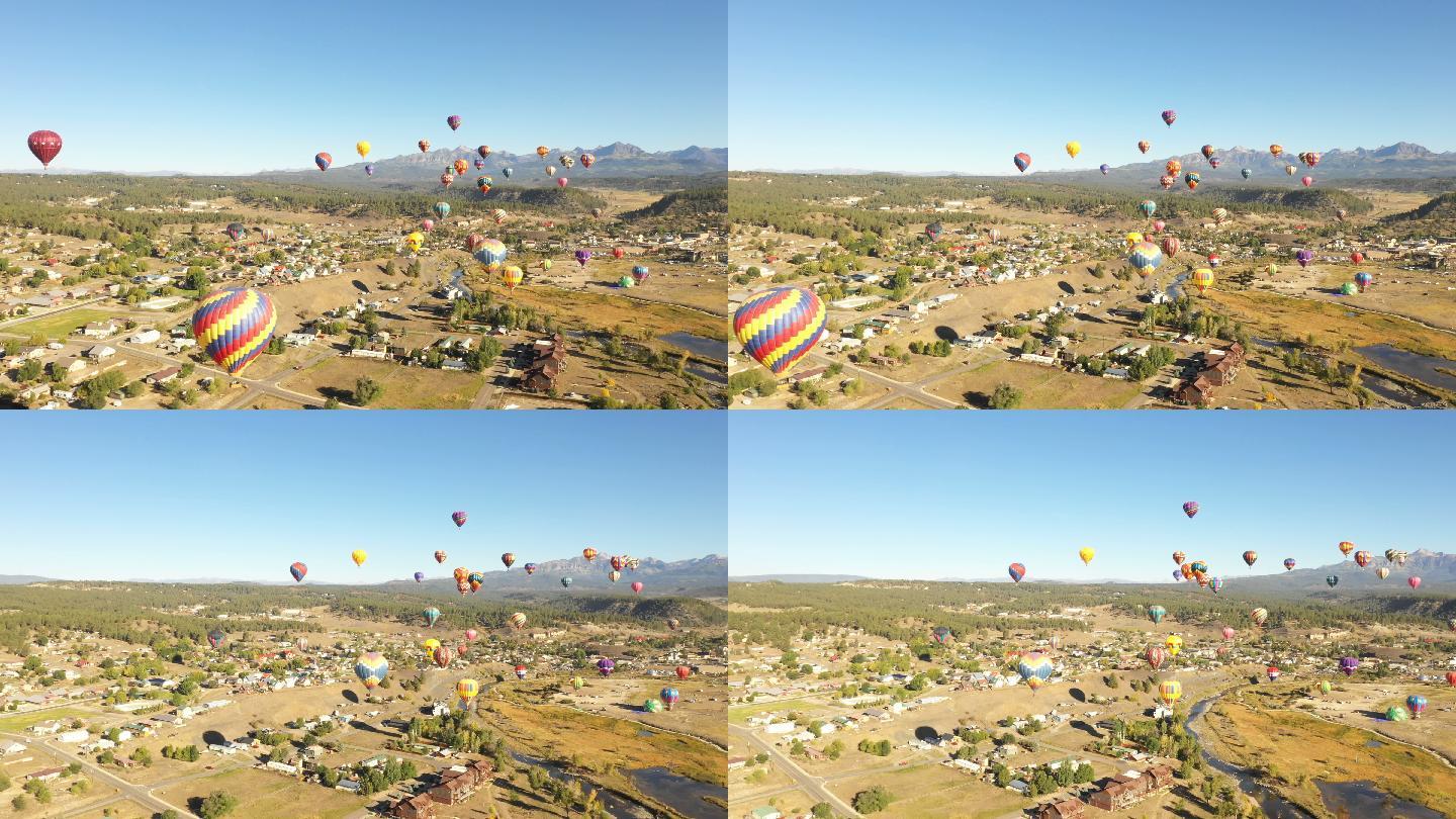 美丽的热气球漂浮在城市上空