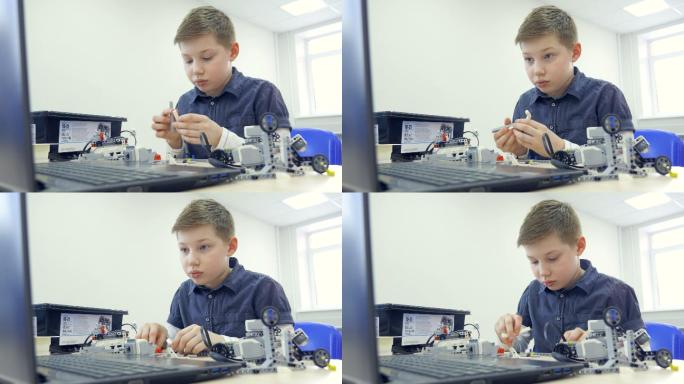 组装机器人的男孩的画像。