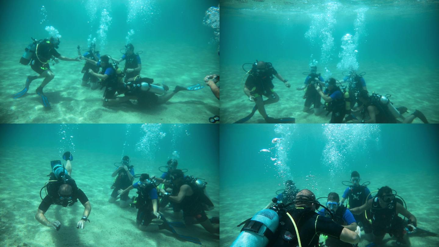 一群潜水员在水下进行潜水训练