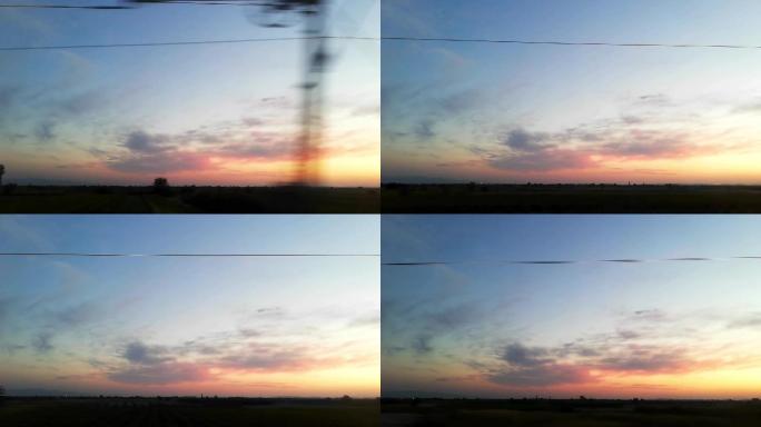 旅行中从火车窗口看到的日落