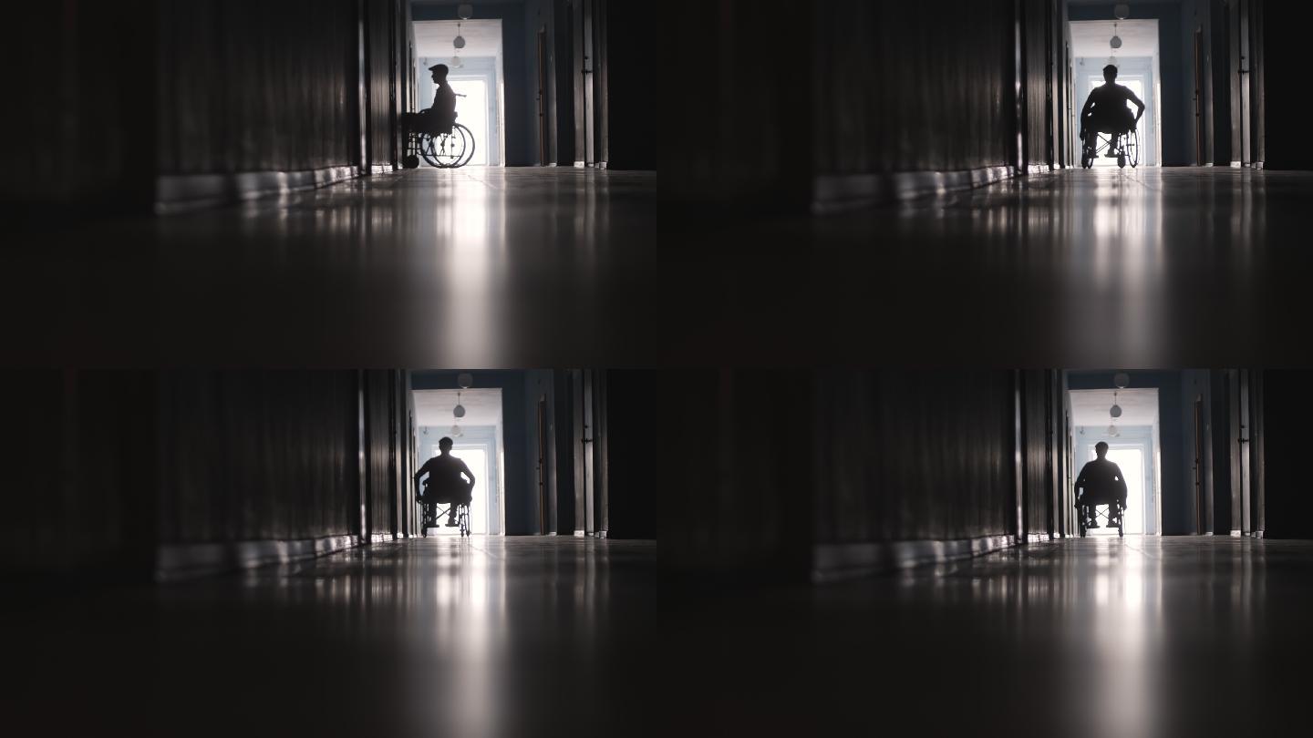 走廊上坐轮椅的人剪影医疗骨科