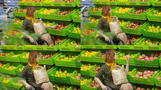 截瘫妇女在杂货店挑选苹果