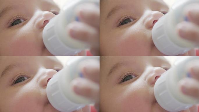 婴儿奶瓶喂养特写慢动作
