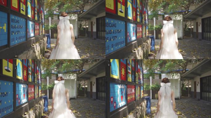 身穿洁白婚纱前行的新娘背影