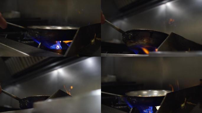 厨师正在使用平底锅炒菜