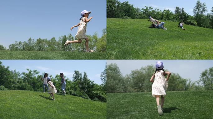 小孩草坪奔跑