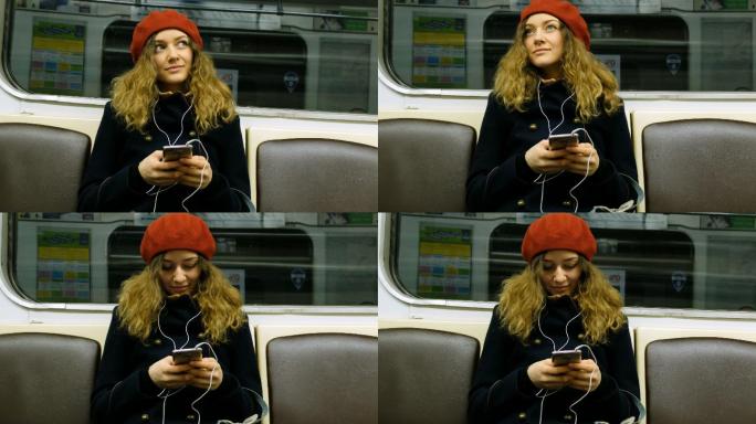 戴着耳机的美女在地铁里用手机