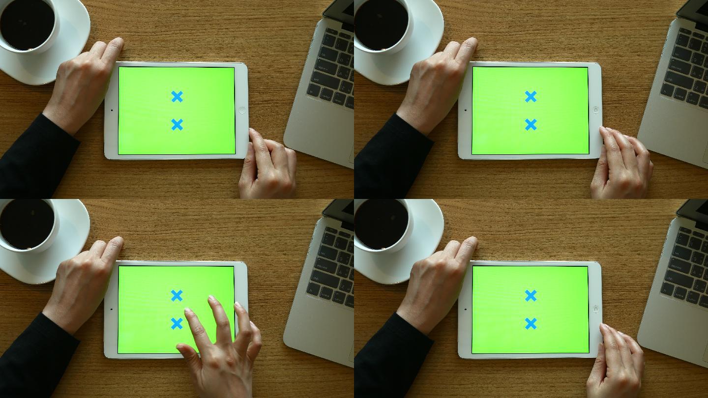 女人使用绿色屏幕的平板电脑