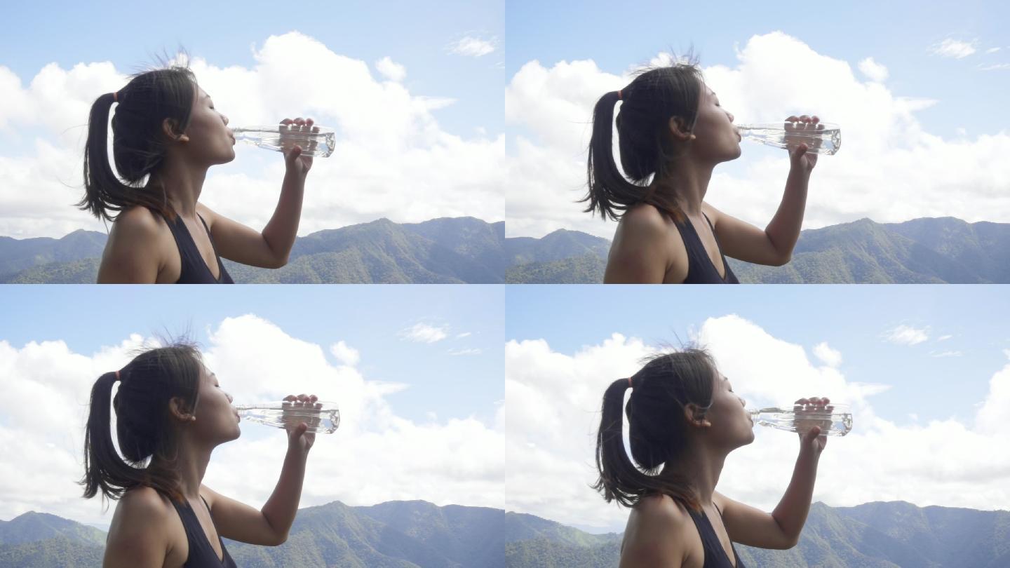 女人跑步后喝水时的慢动作