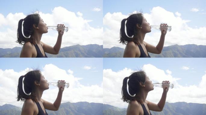 女人跑步后喝水时的慢动作