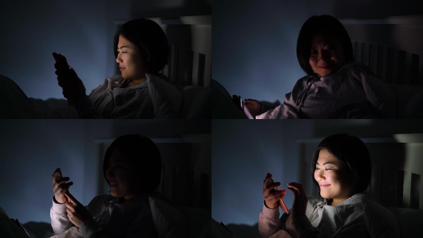 一名女子夜间使用平板电脑