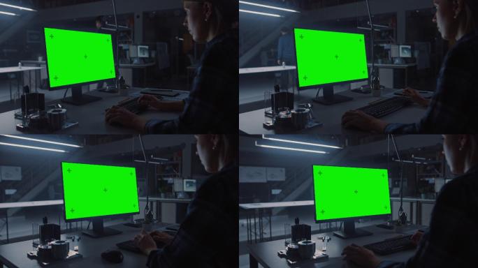 夜间工程师在绿色屏幕电脑上工作